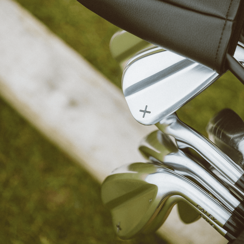 Caley 01 irons in a golf bag on the course